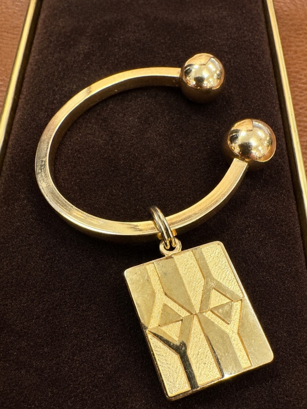 Yves Saint Laurent Vintage Gold-Tone Open Cuff Key Holder with Geometric Charm